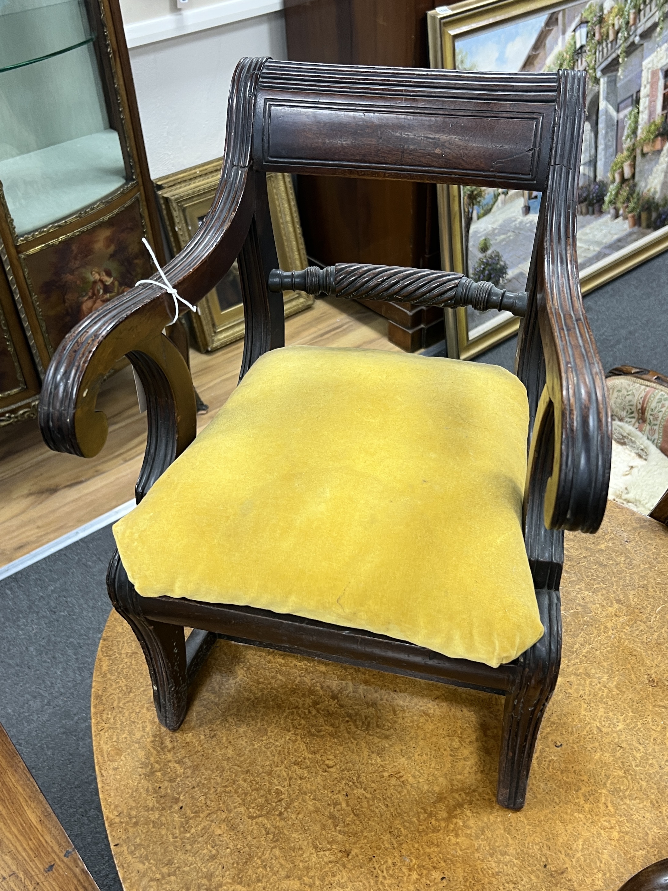 A Regency mahogany child's elbow chair, width 50cm together with an Edwardian inlaid mahogany candle stand
